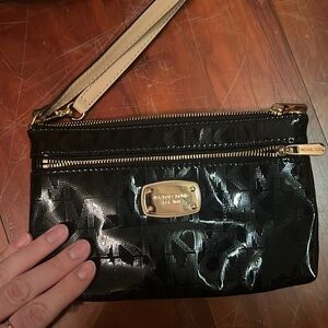 Michael Koran black shiny clutch